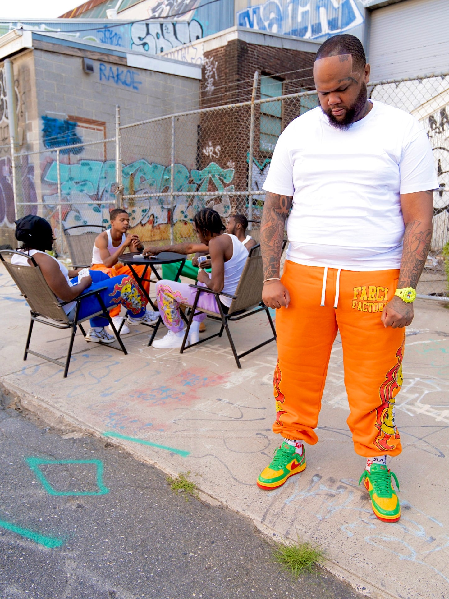 Smiley face sweatpants orange